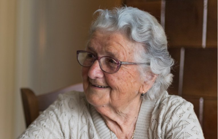 An older woman smiling 