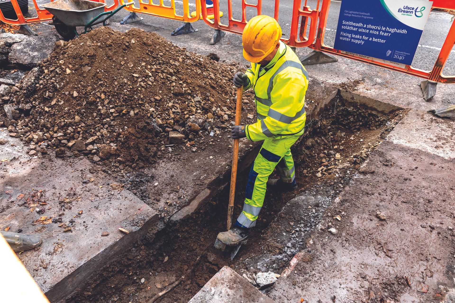 Worker in open trench