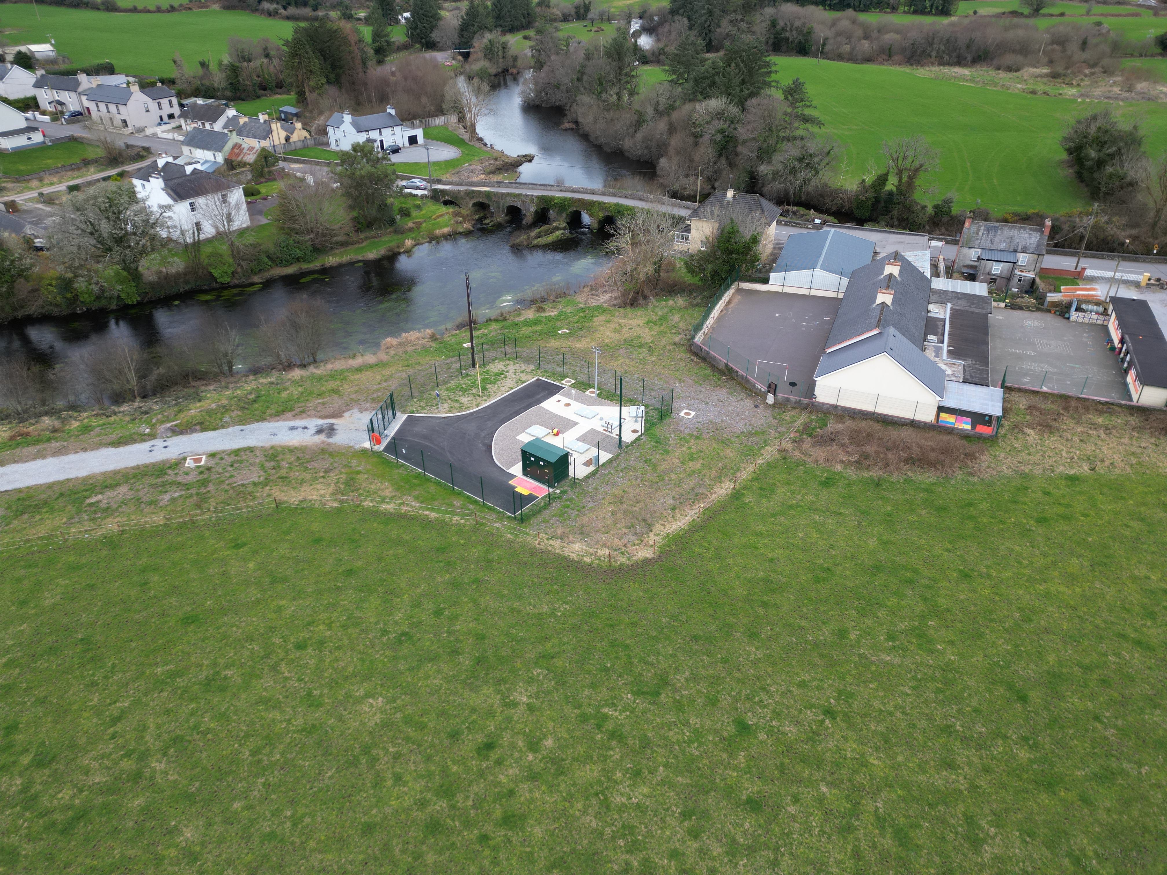A small housing neighbourhood beside a bridge over a river