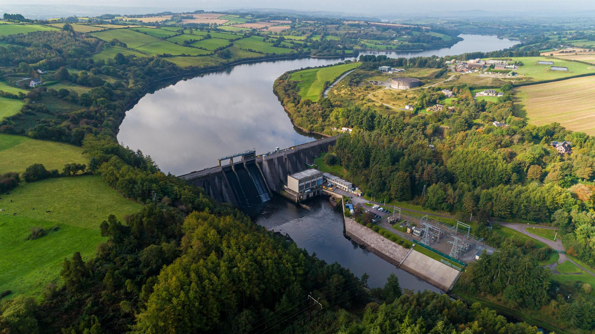 A dam in front of a complex between two grasslands in Inniscara, Co. Cork