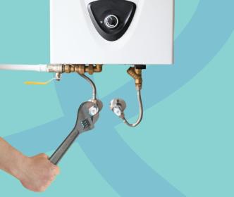 A person fixing a water boiler with a wrench