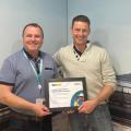 Dermot Mulligan presented with an award by David McCloone, IDD Programme Manager