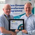 John Ward accepting an award by Alan Milton Head of Infrastructure Delivery Commercial Team