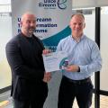 Kieran Neary receiving an award