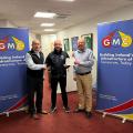 Left to Right from Aidan’s Award Presentation: Paul Gray (UÉ), Aidan Devine & Trevor Troy (GMC).