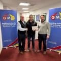 James was presented with his Award by  Paul Gray (L), UÉ and Dermot Dolan (R), GMC.