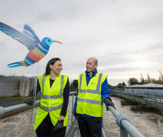 Uisce Éireann workers at a water treatment plant, with a cardboard cutout bird