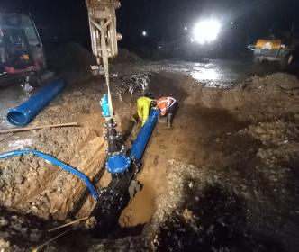 Workers repairing a water main