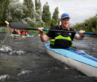 A man kayaking on a river