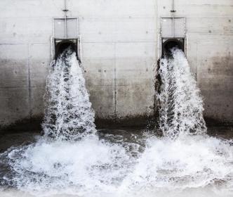 Wastewater plant pouring water through pipes