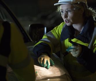 An engineer pointing at a map